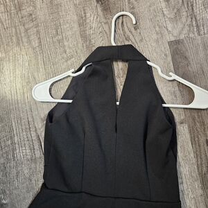 Classic black long dress with a slim fit V-neck, perfect for a party.